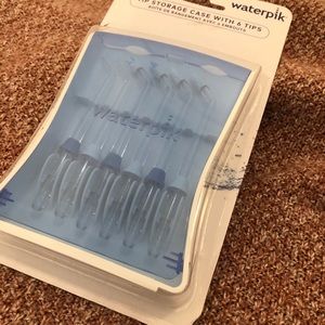 Never opened water pic case and tips.